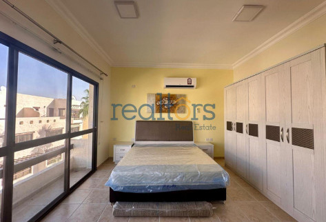 Rustic charm, cozy 1BR with balcony in a Compound