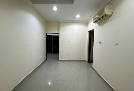 A room and a lounge with a kitchen and a comprehen - Apartment in Umm Salal Ali