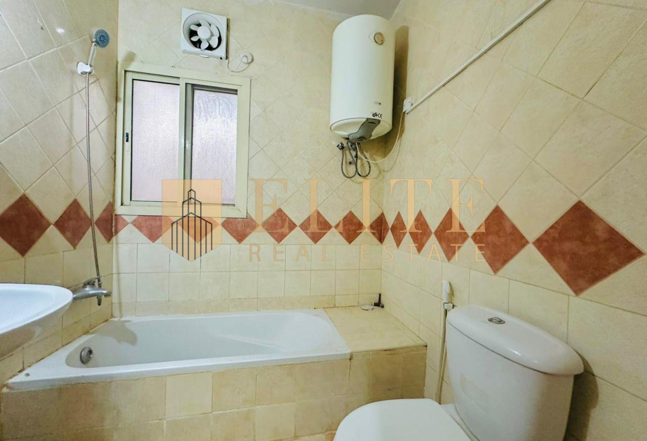 Spacious Unfurnished 1BHK | Prime Location - Apartment in Umm Ghuwailina